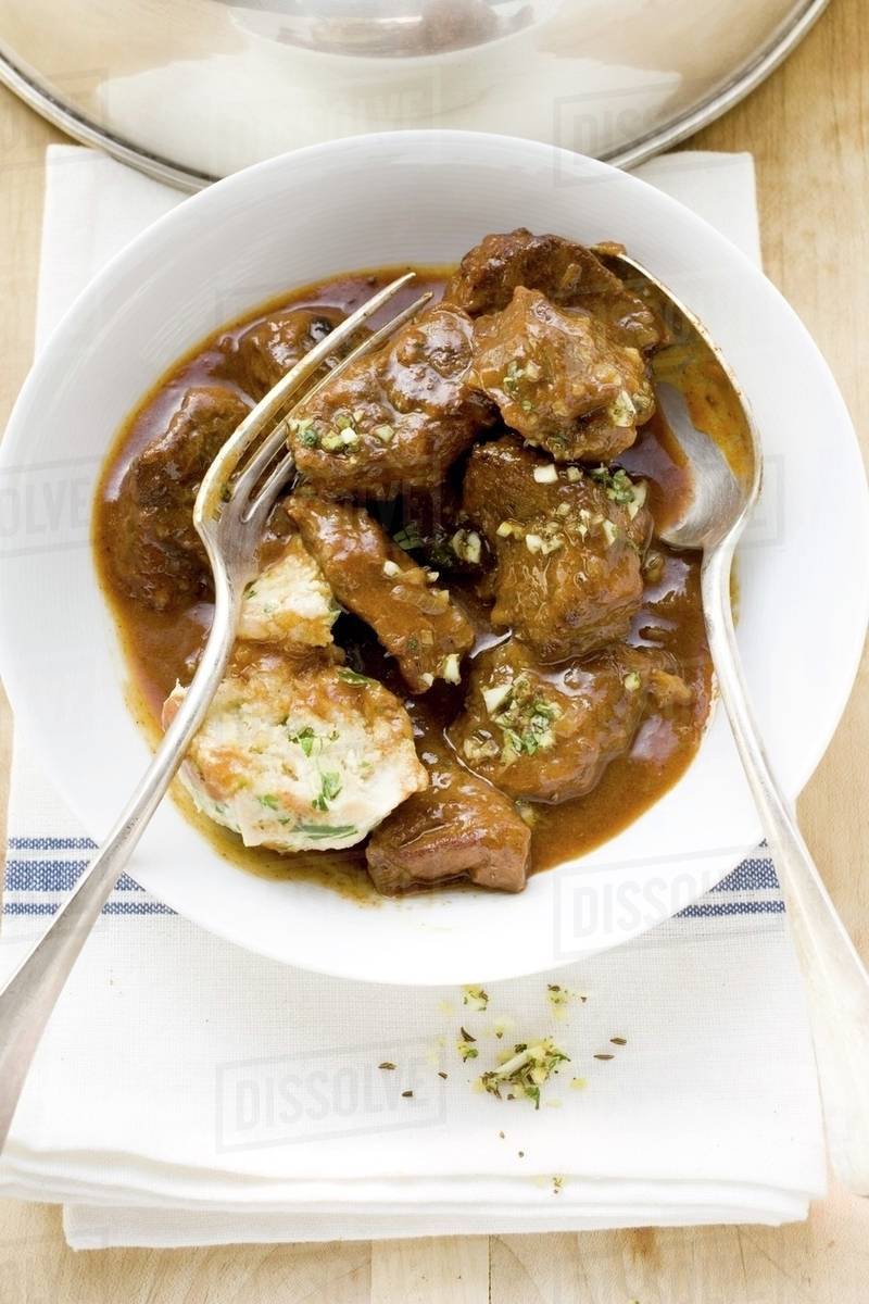 Beef goulash with bread dumpling Stock Photo Dissolve