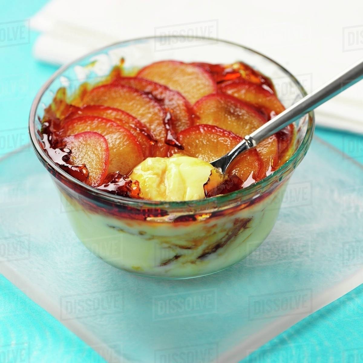 Cream dessert topped with plums Stock Photo Dissolve