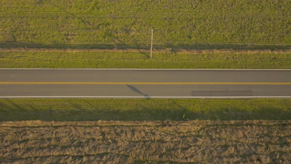 Overhead view of highway passing through landscape area - Stock Video ...