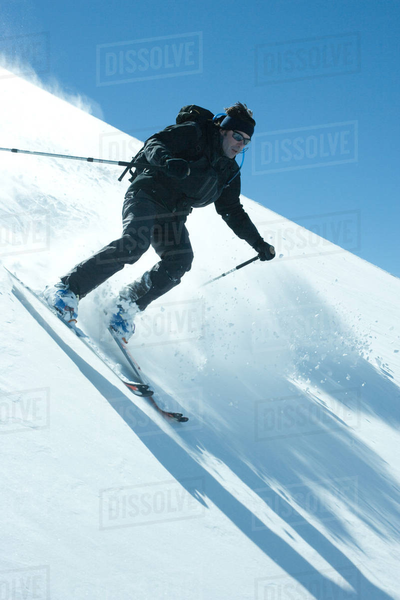 Skier skiing downhill Stock Photo Dissolve