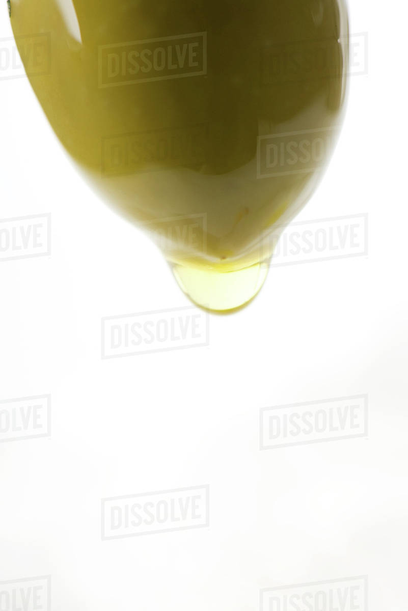 Olive dripping olive oil Stock Photo Dissolve