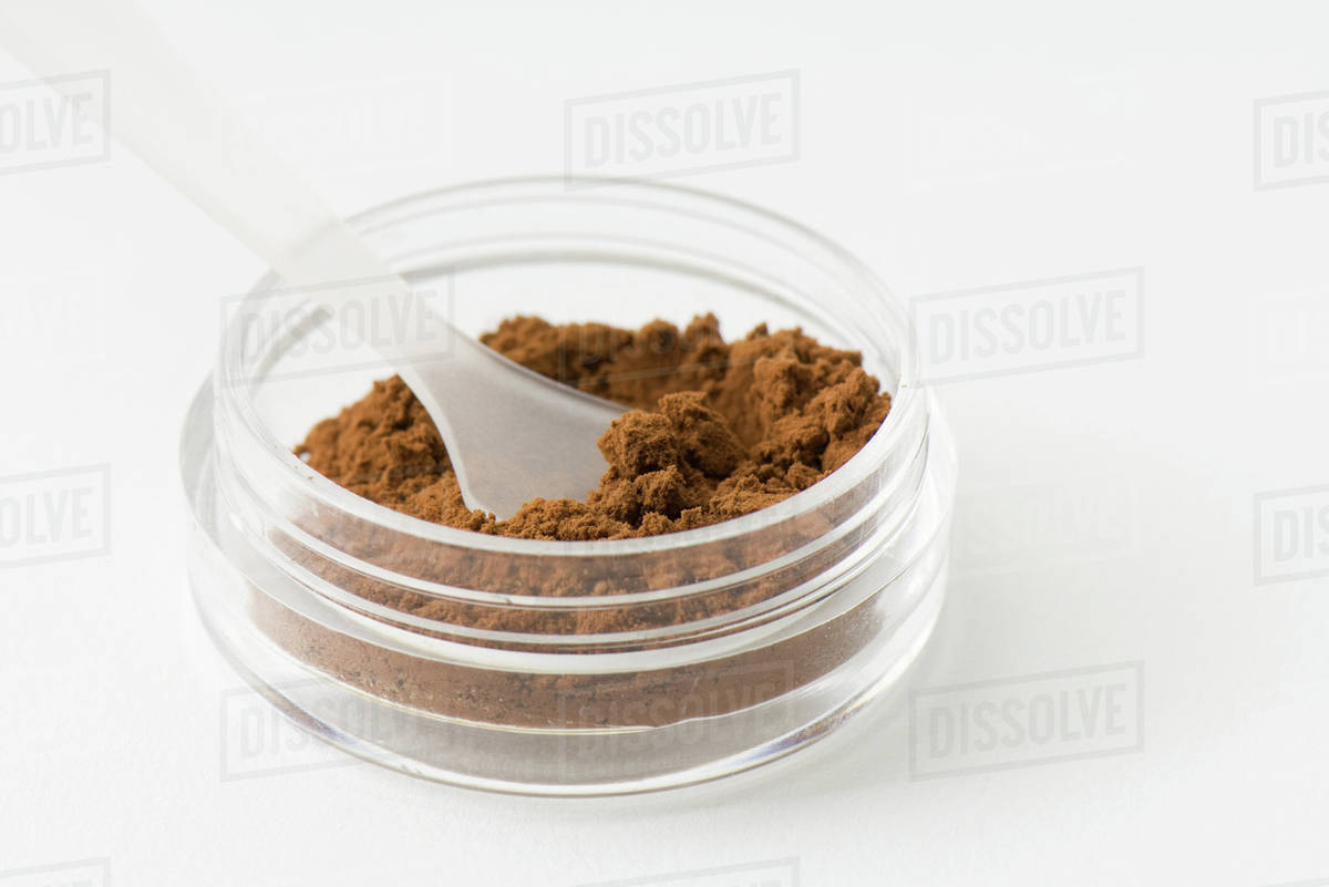 Cocoa powder in small container Stock Photo Dissolve