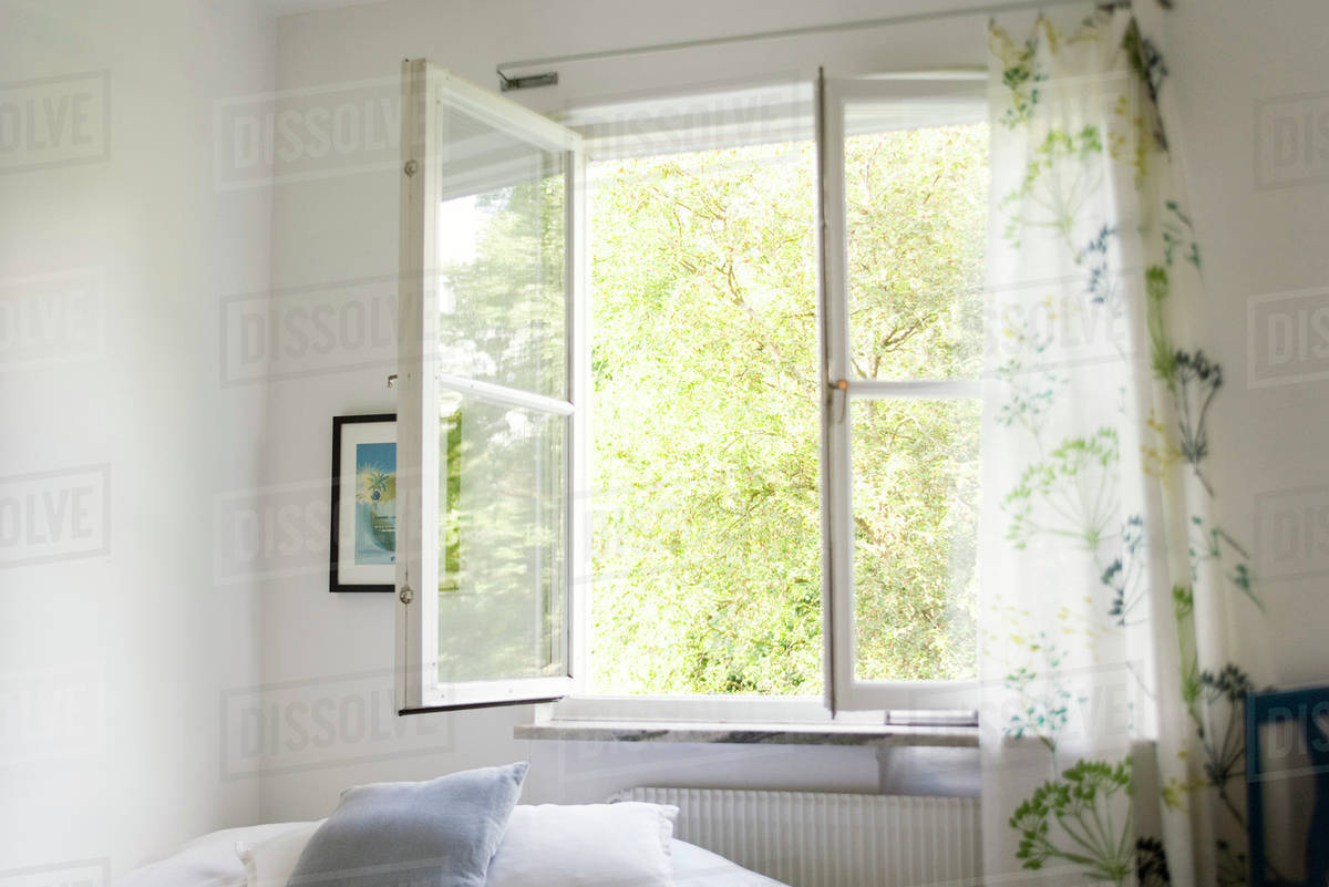 Open window in bedroom - Stock Photo - Dissolve