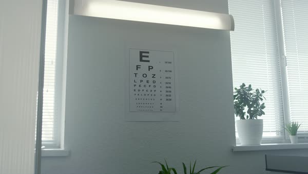 Standard eyesight test chart hanging white wall in doctor office close ...