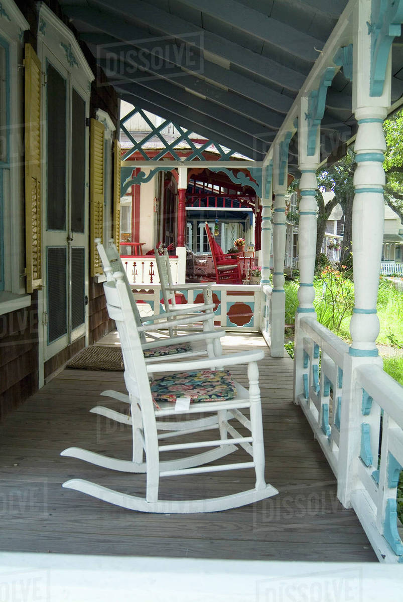 Rocking chairs on veranda Stock Photo Dissolve