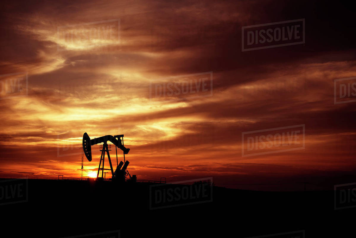 Pump Jack in Oilfield at Sunset, Saskatchewan, Canada Stock Photo Dissolve