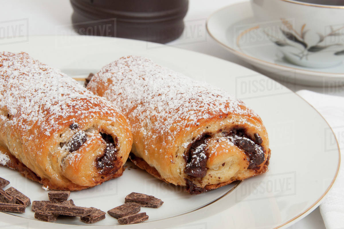 Powdered sugar on chocolate croissants Stock Photo Dissolve