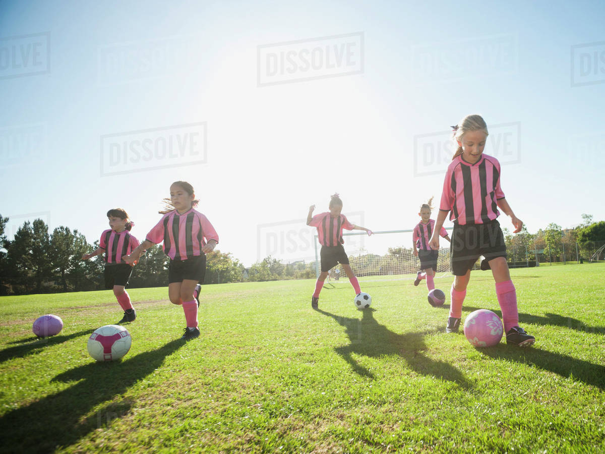 Girl soccer players practicing with soccer balls Stock Photo Dissolve
