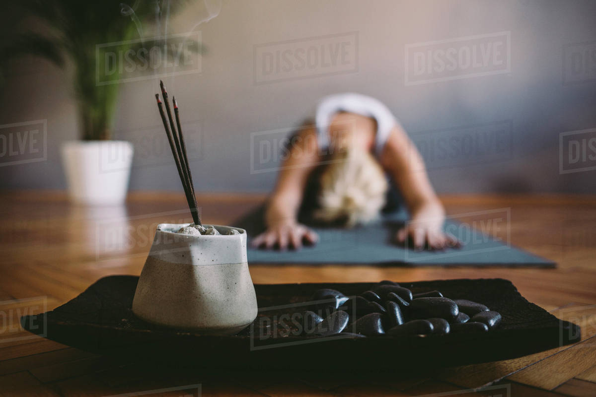 Incense burning in yoga studio Stock Photo Dissolve