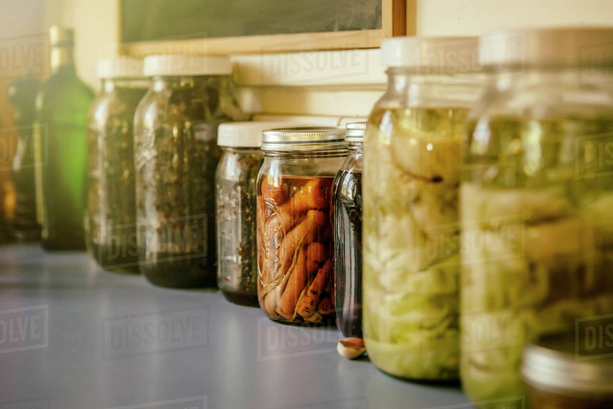 Close up of jars of preserves Stock Photo Dissolve