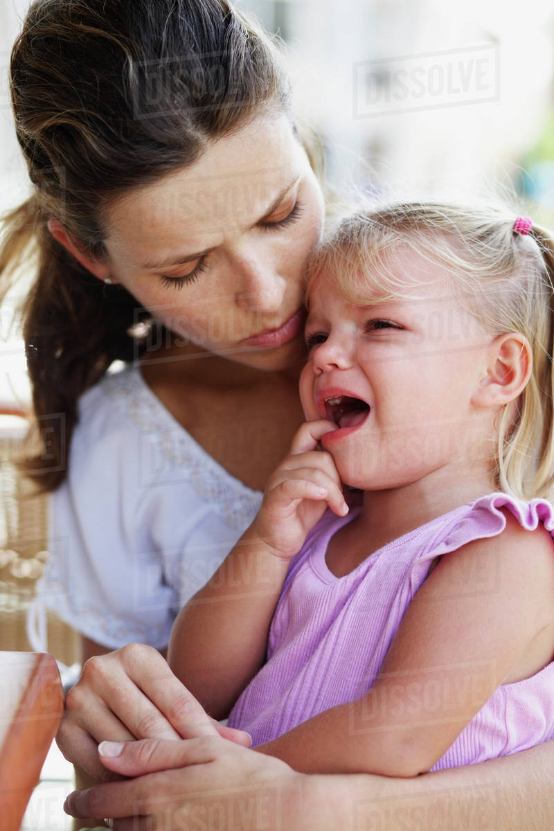 Hispanic Mother Comforting Crying Daughter Stock Photo Dissolve