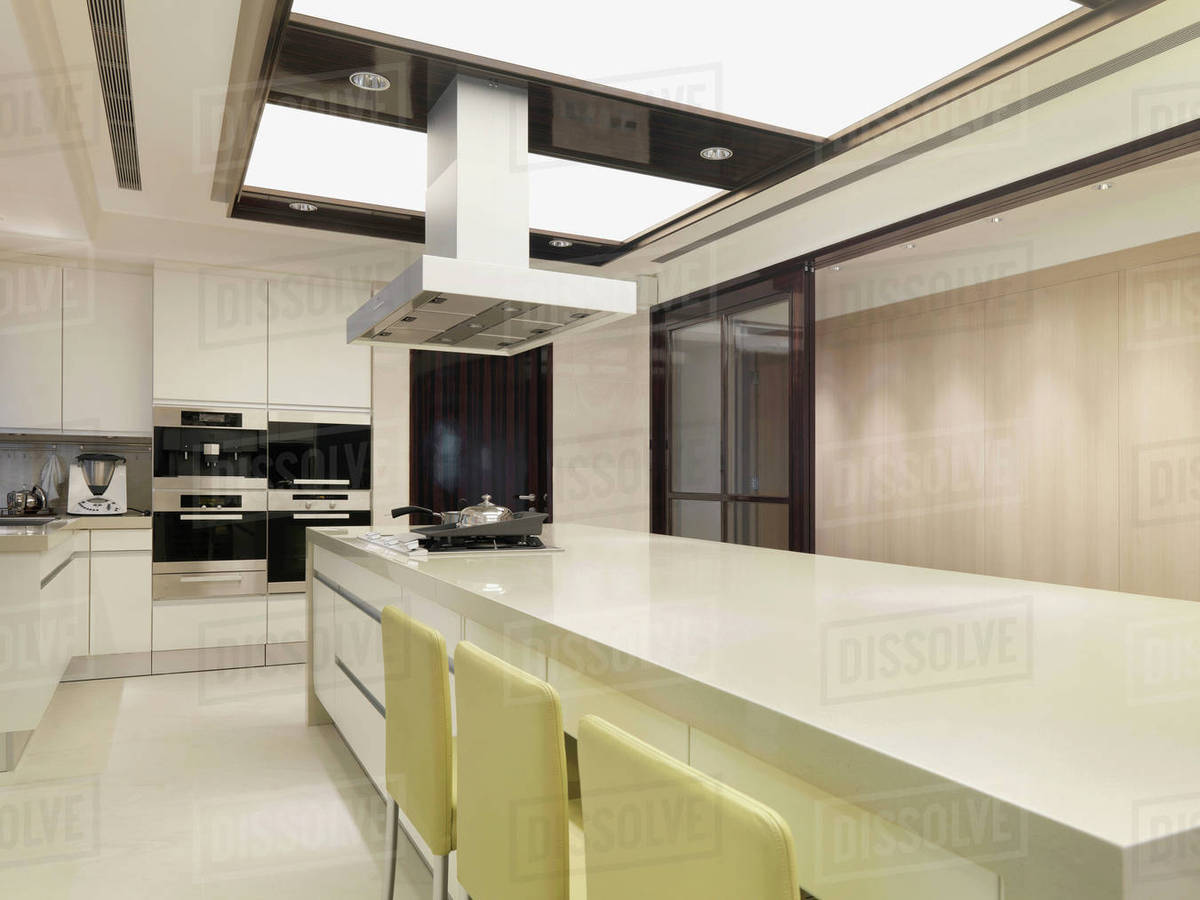 Long countertop in modern kitchen Stock Photo Dissolve