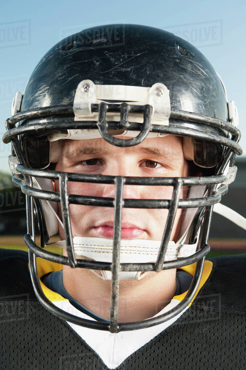 Serious Caucasian football player in helmet Stock Photo Dissolve