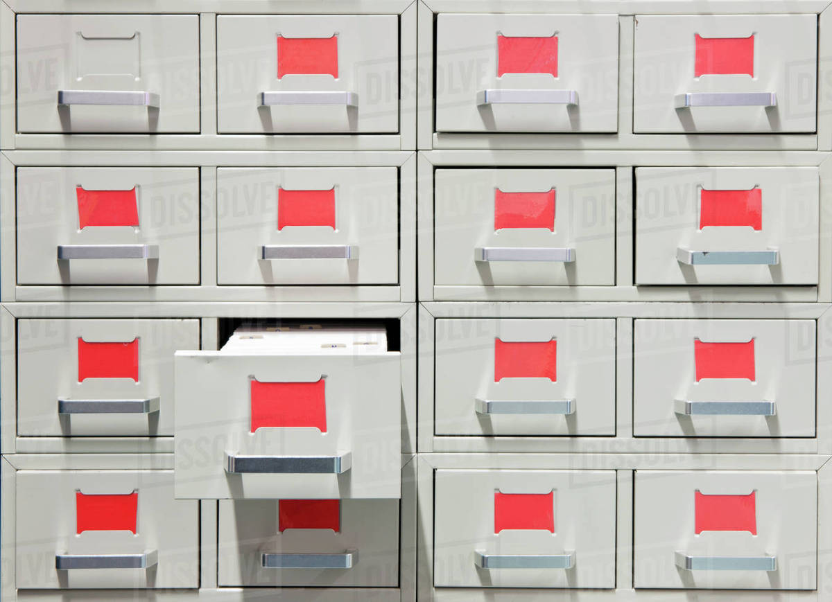 Drawers And Red Labels In An Antique Archive Cabinet Stock Photo