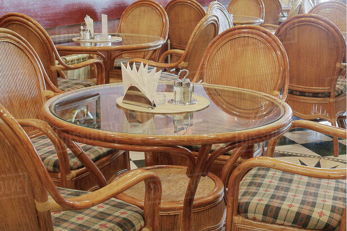 Table and chairs in restaurant Stock Photo Dissolve