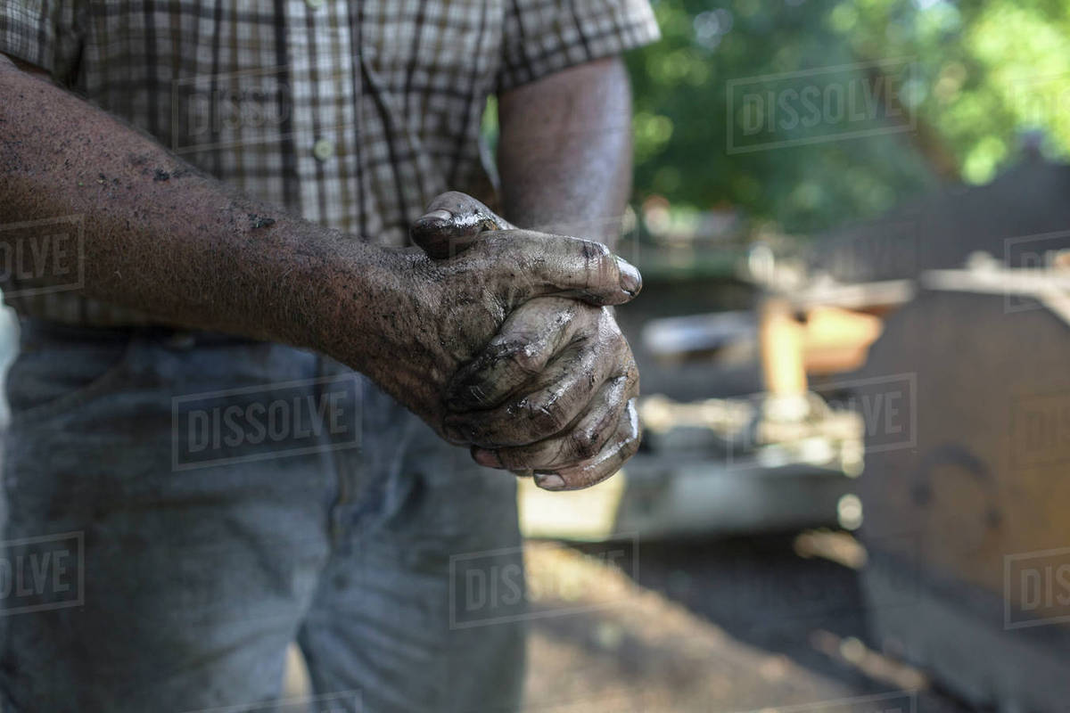 Greasy hands of man Stock Photo Dissolve