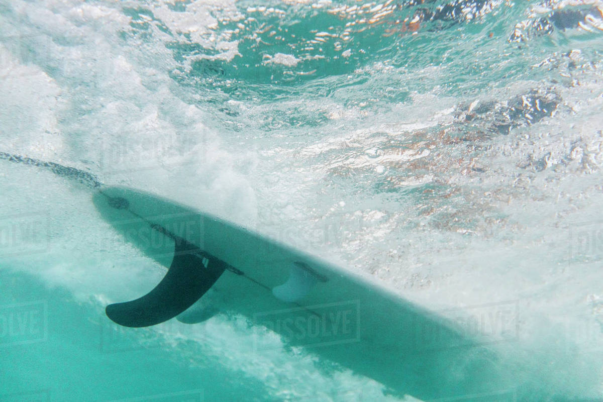 Underwater view of surfboard Stock Photo Dissolve