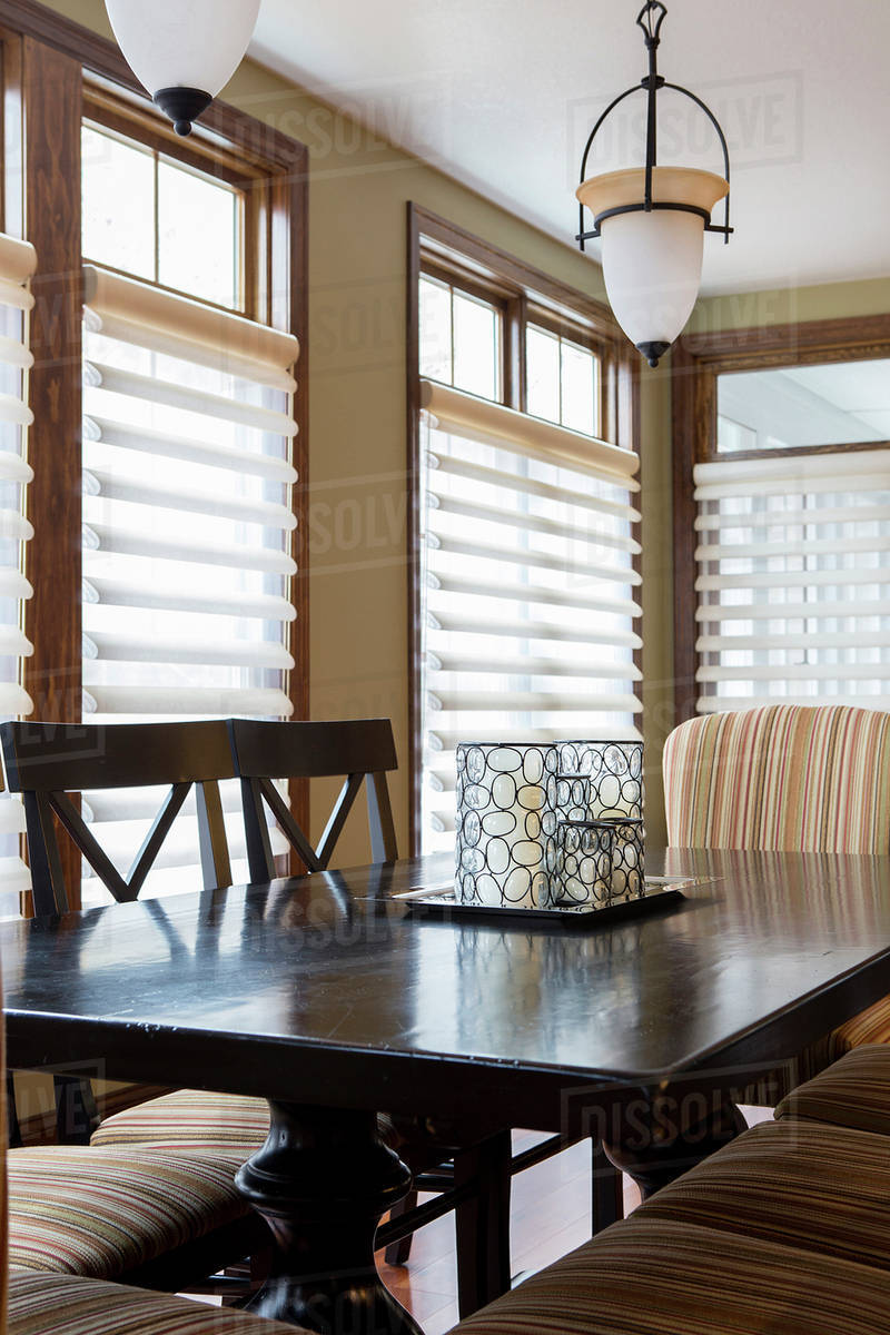 Dining table and chairs in dining room Stock Photo Dissolve