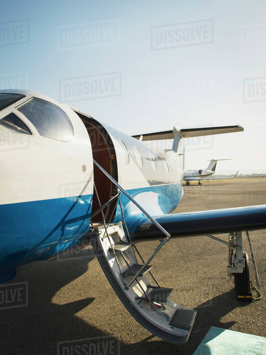 Airplane grounded on runway Stock Photo Dissolve