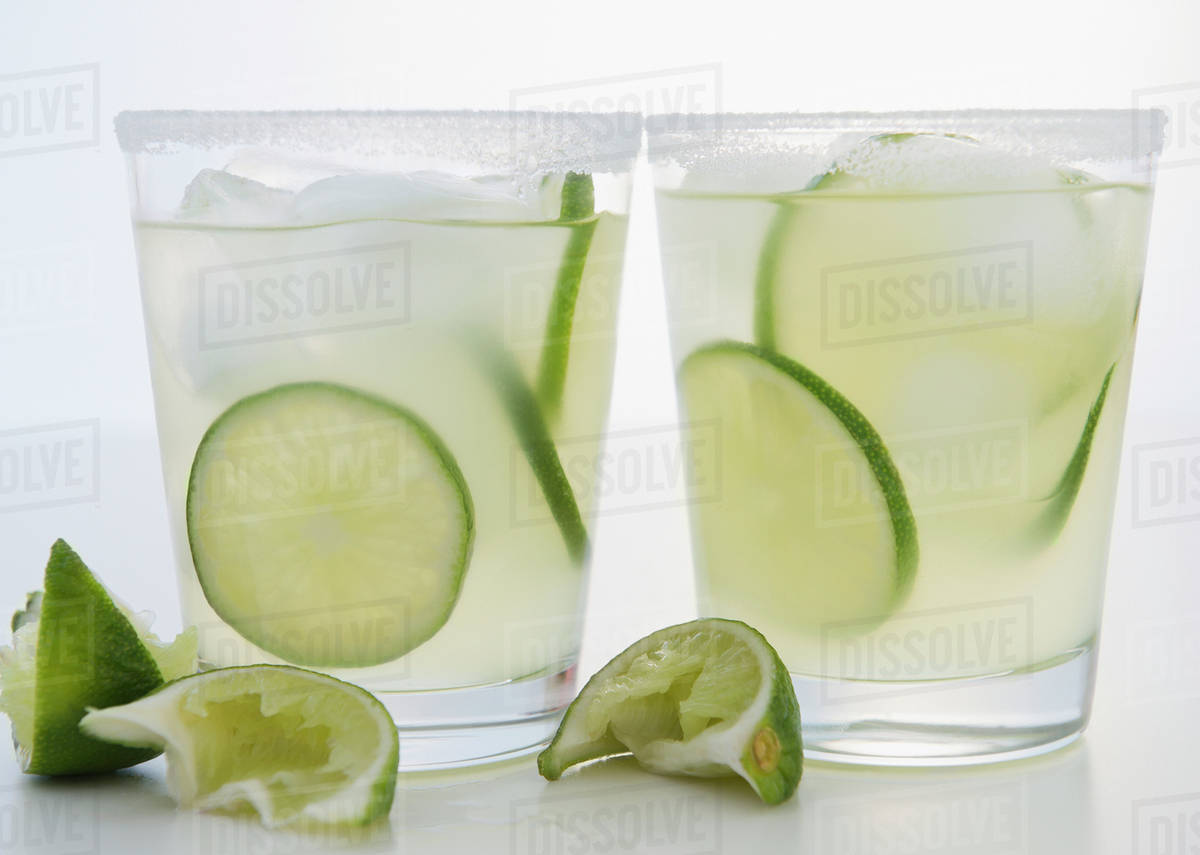 Limes in margaritas Stock Photo Dissolve