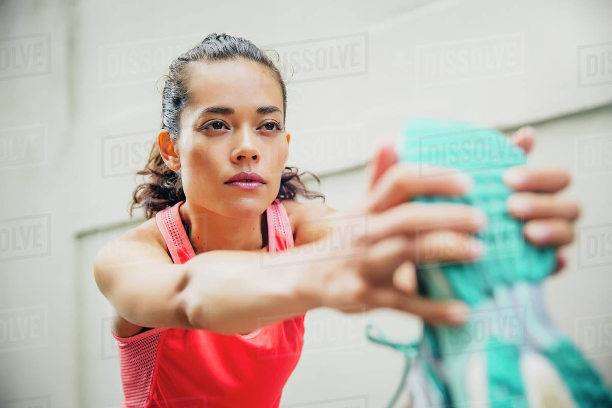 Mixed race athlete stretching outdoors Stock Photo Dissolve