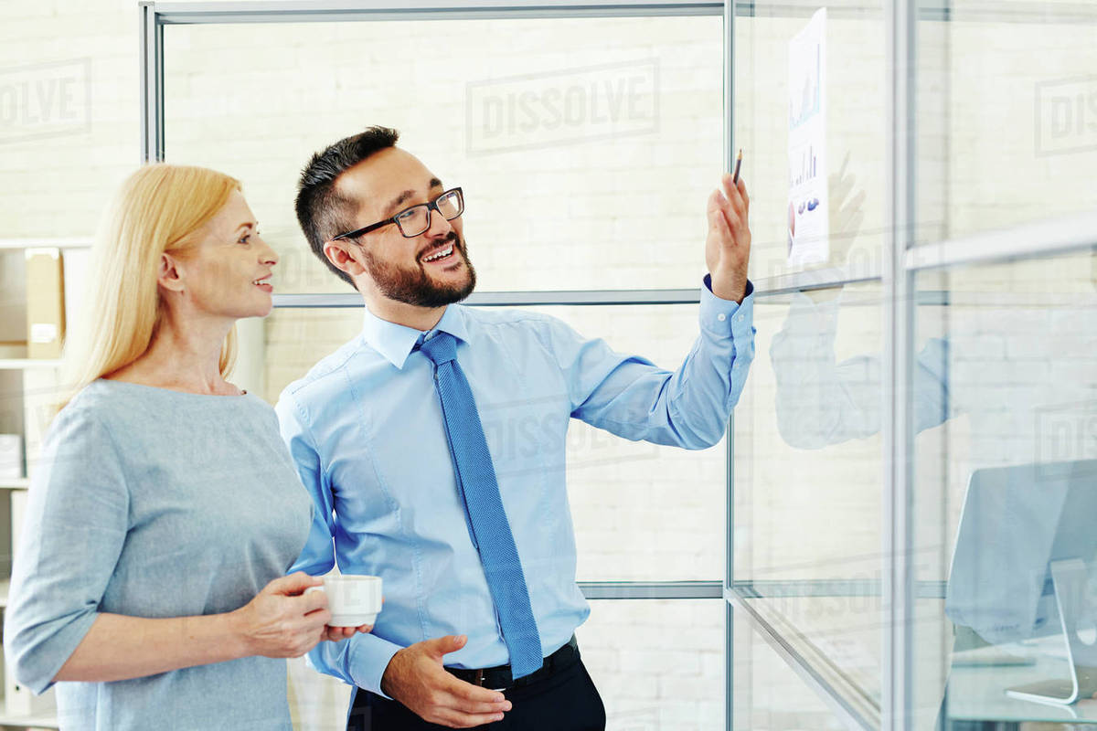 young manager presenting strategy to his mature partner stock presenting strategy