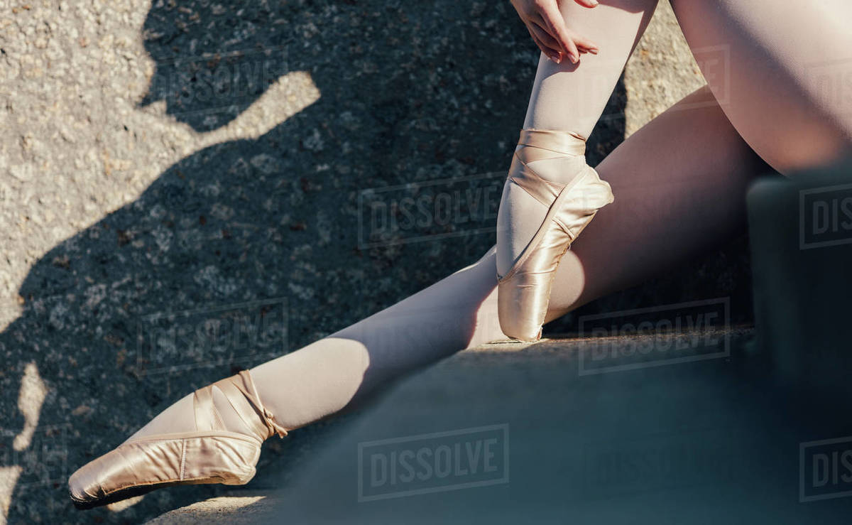 Closeup of ballet dancer sitting Ballet dancer wearing