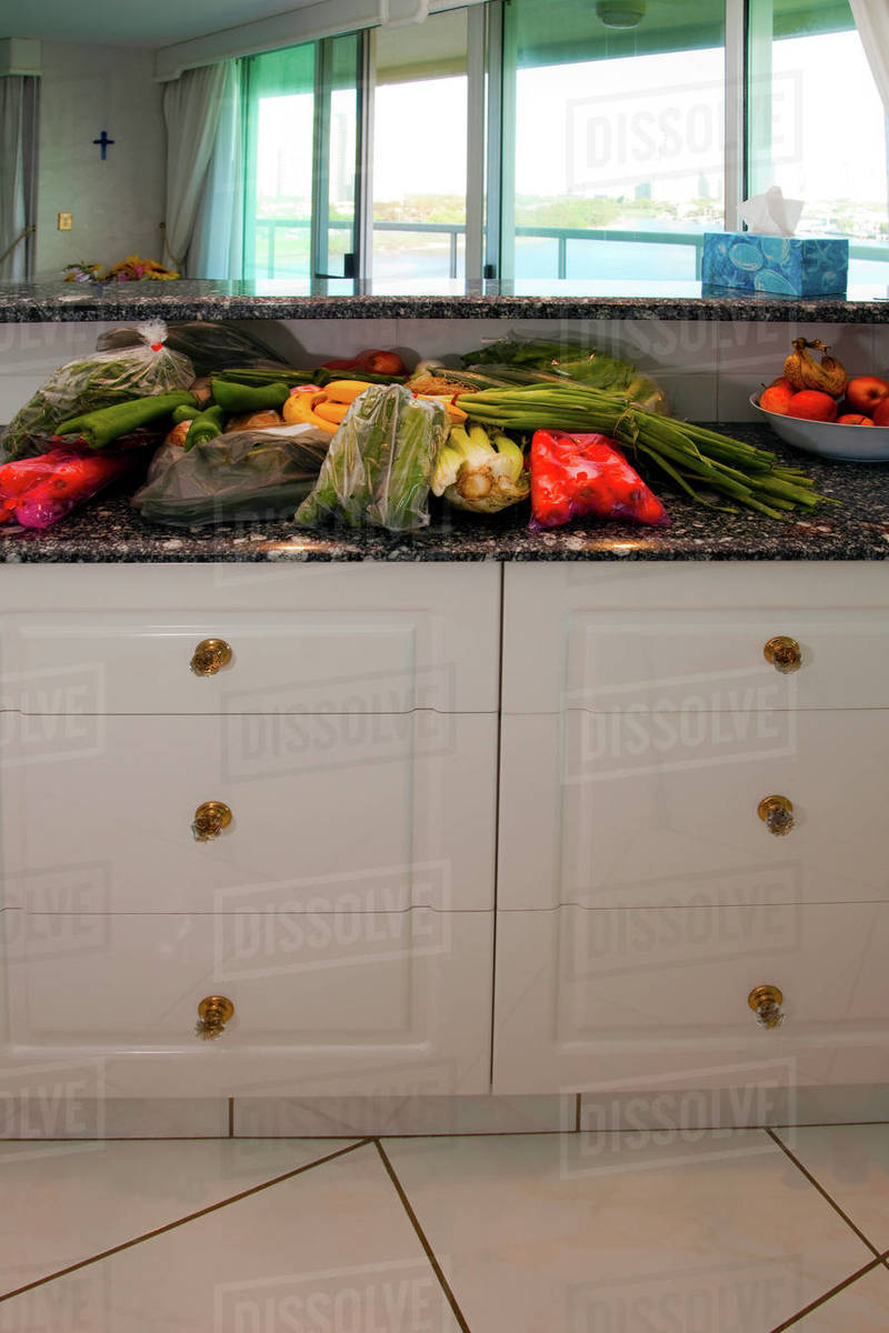 Grocery bags in kitchen Stock Photo Dissolve