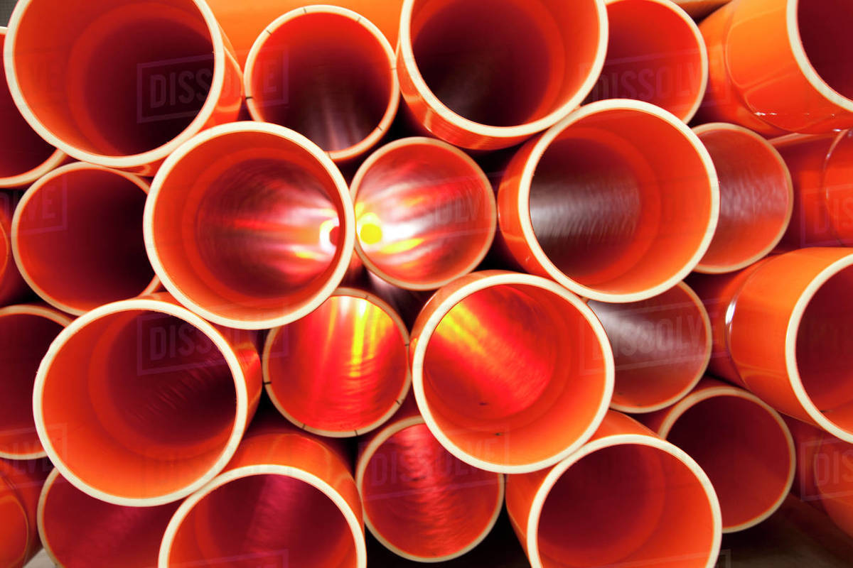 PVC pipes stacked in a construction site Stock Photo Dissolve