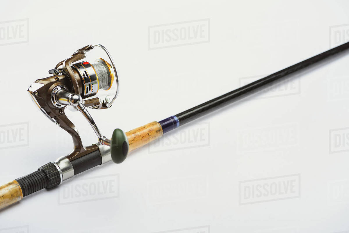 Close up view of fishing rod isolated on white, minimalistic concept