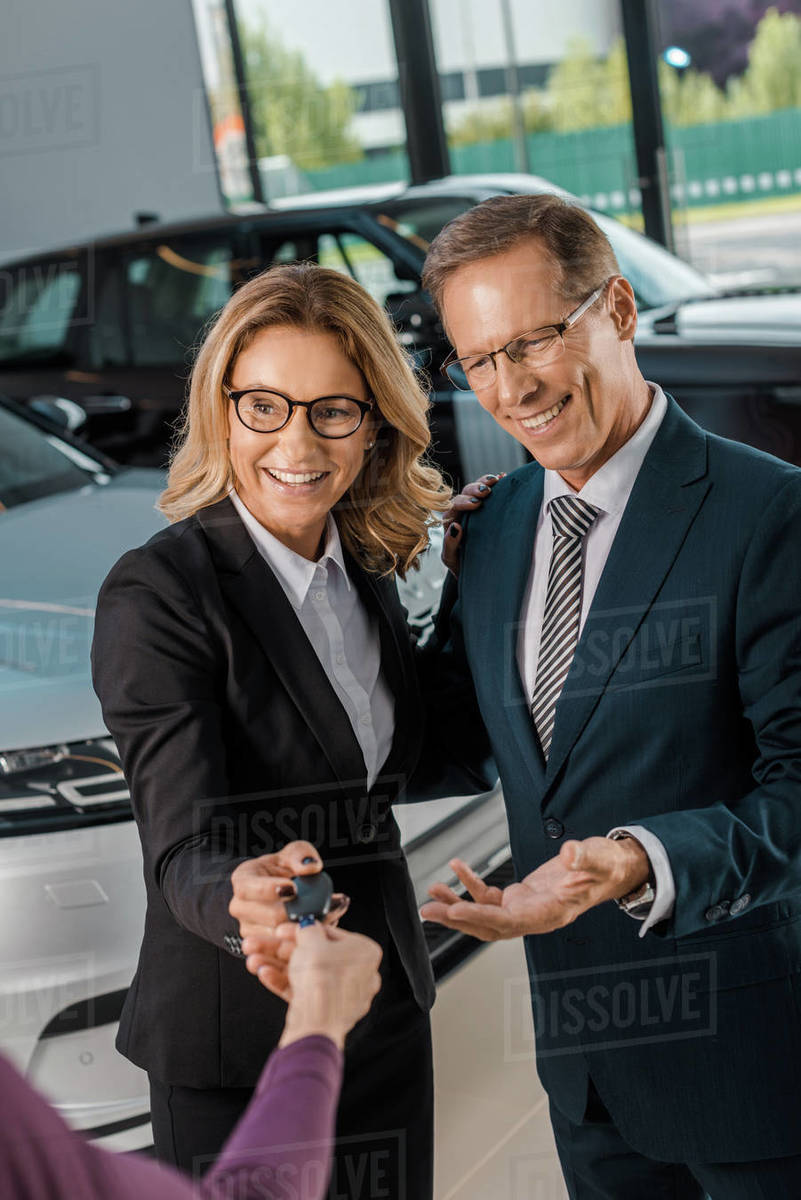 Key Car Dealership >> Partial View Of Female Car Dealer Giving Car Key To D2115 135 086 Key Car Dealership >> Partial View Of Female Car Dealer Giving Car Key To D2115 135 086