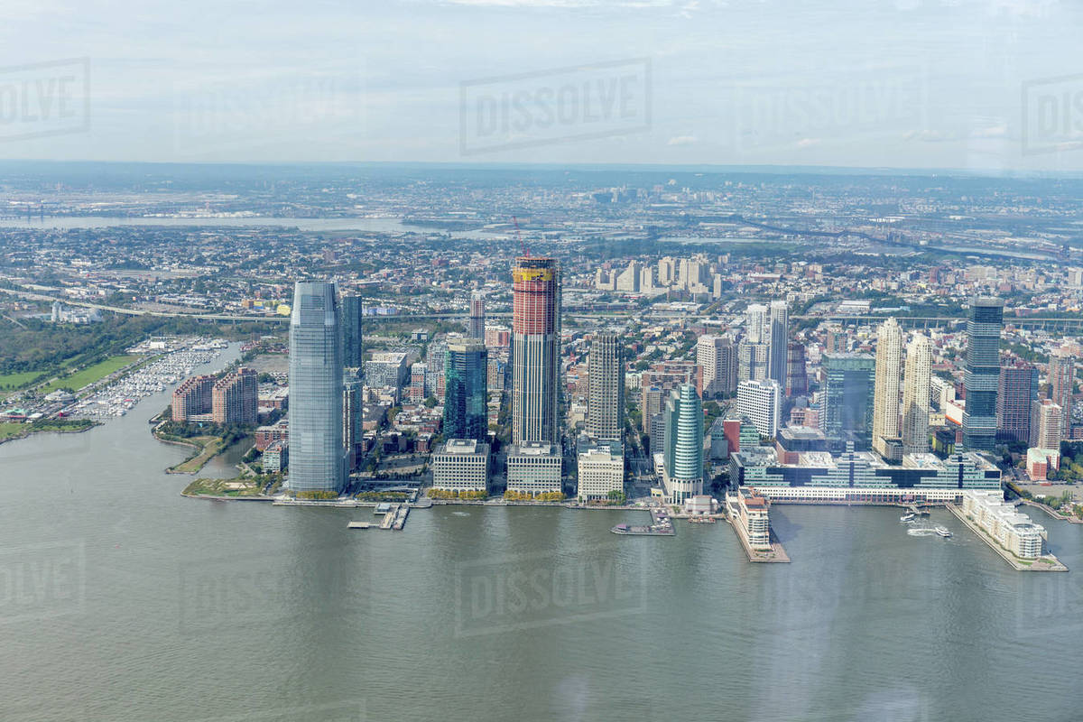 Aerial view of new York buildings and Atlantic ocean, USA - Stock Photo - Dissolve