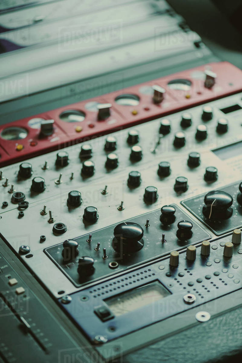 closeup shot of graphic equalizer with various knobs at recording