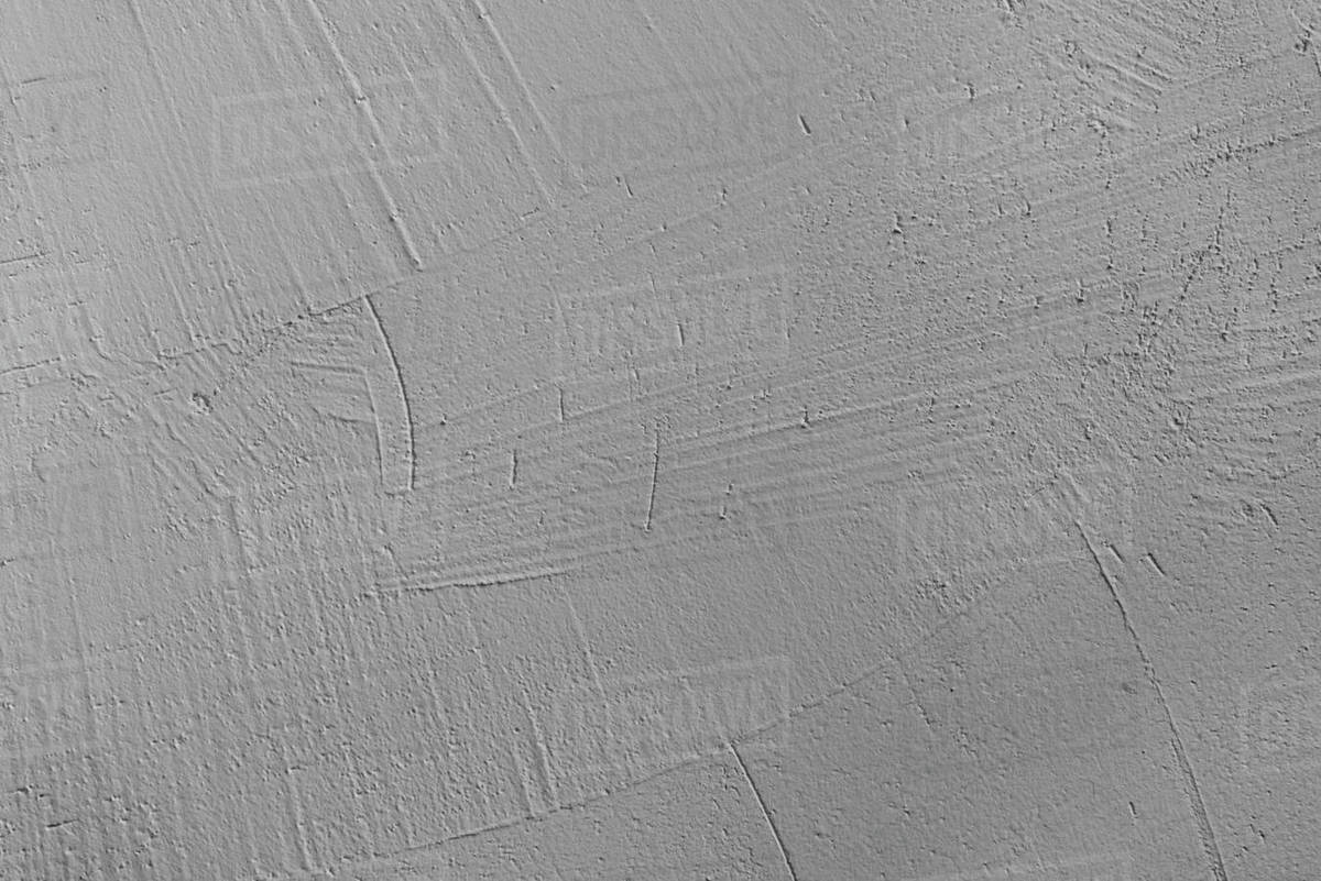 Old grey plaster on wall background Stock Photo Dissolve