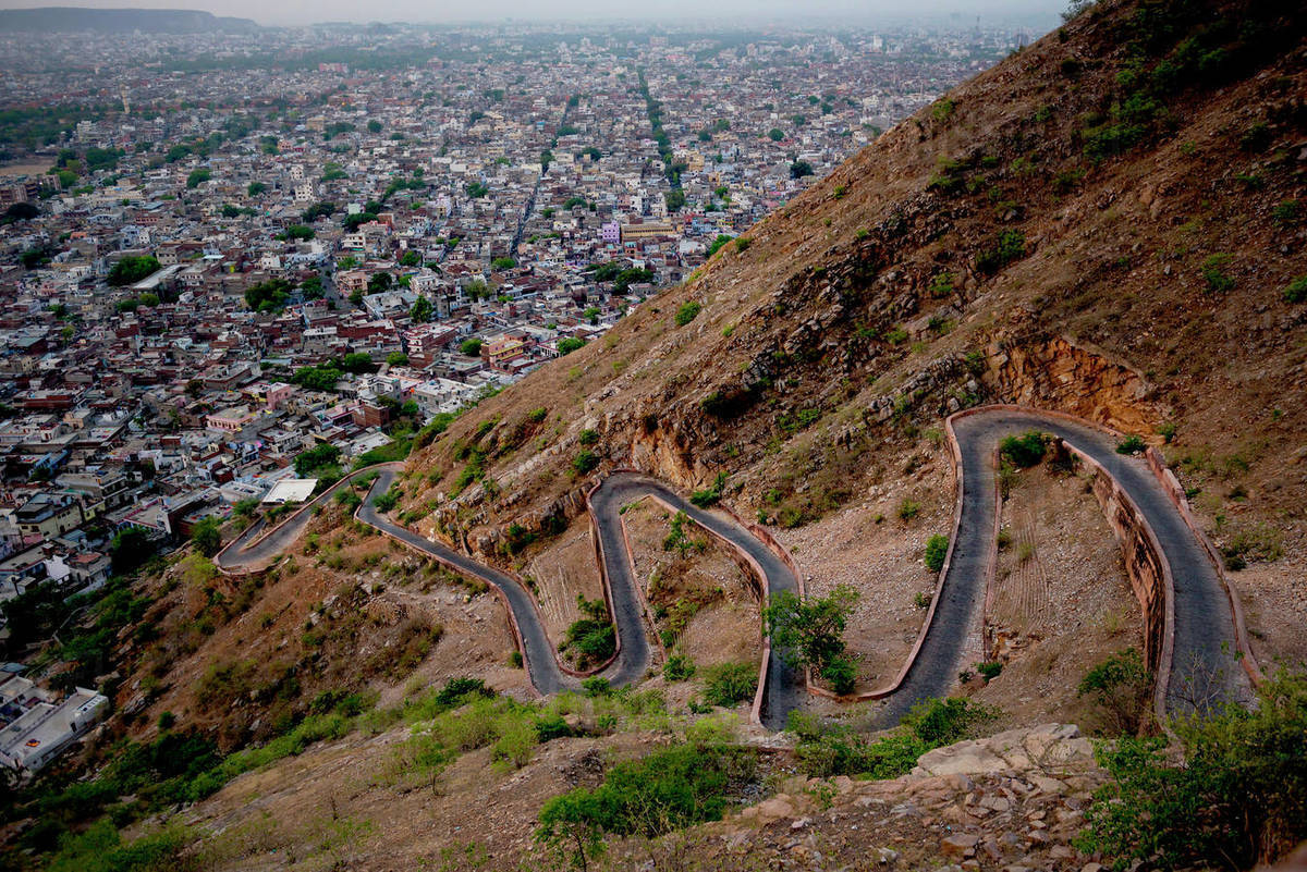 A switchback road and Jaipur city seen from Tiger Fort, Rajasthan
