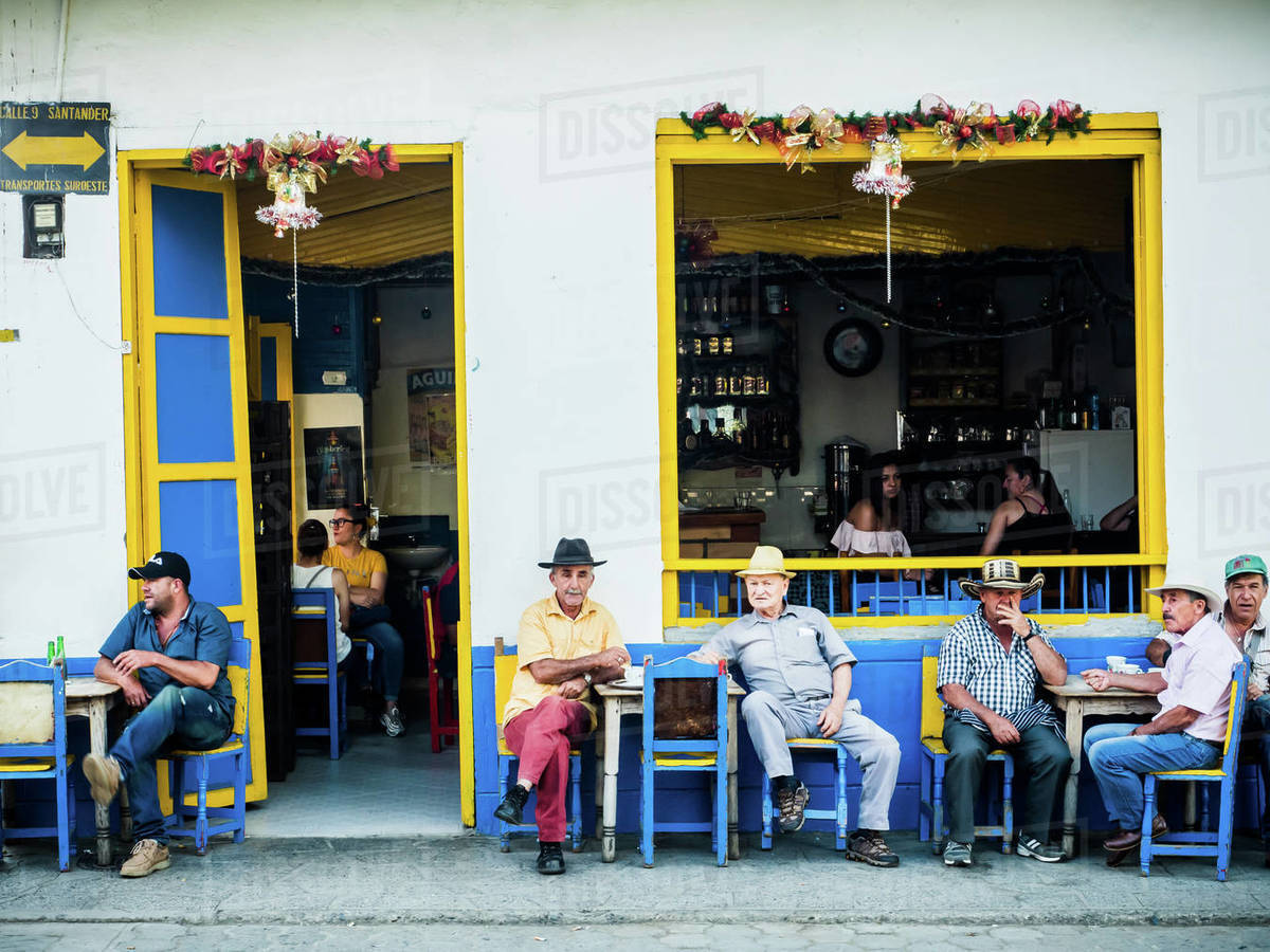 Men sit outside a bar, Jardin, Antioquia, Colombia, South America Royalty-free stock photo