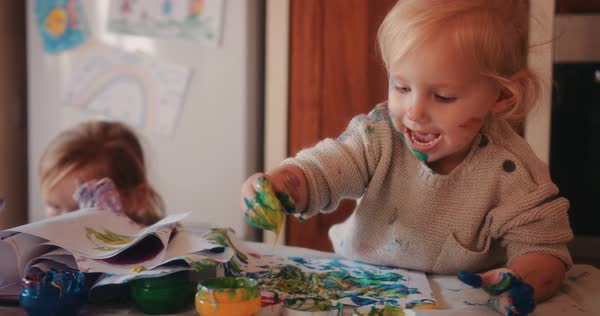 Happy Little Toddlers Finger Painting In Family House Kitchen Royalty Free Stock Video Happy Little Toddlers Finger Painting In Family House Kitchen Royalty Free Stock Video