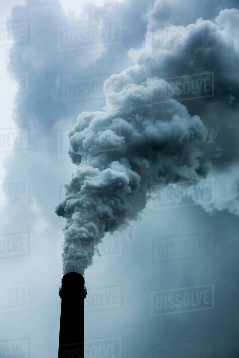 China, Chongqing, Steam and smoke billows from smokestacks at massive coalfired power plants on