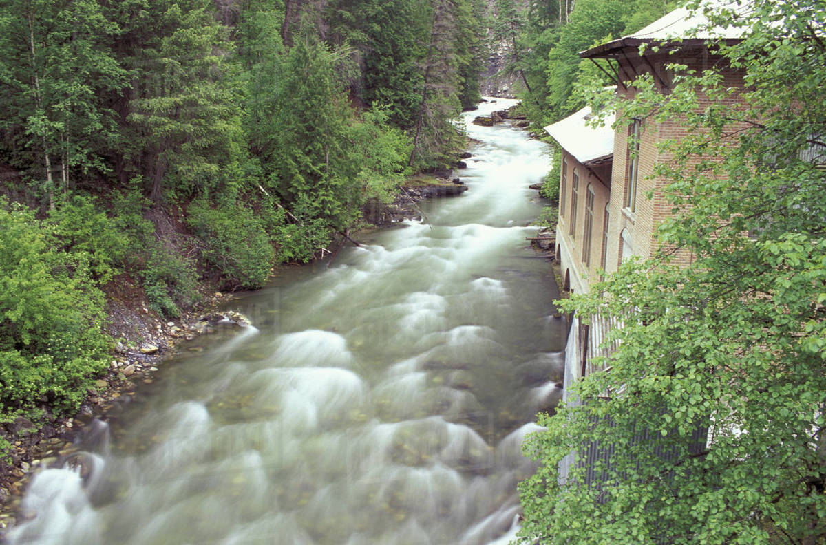 N.A., USA, Washington, Metaline Falls, An old power plant on Sullivan Creek Stock Photo Dissolve