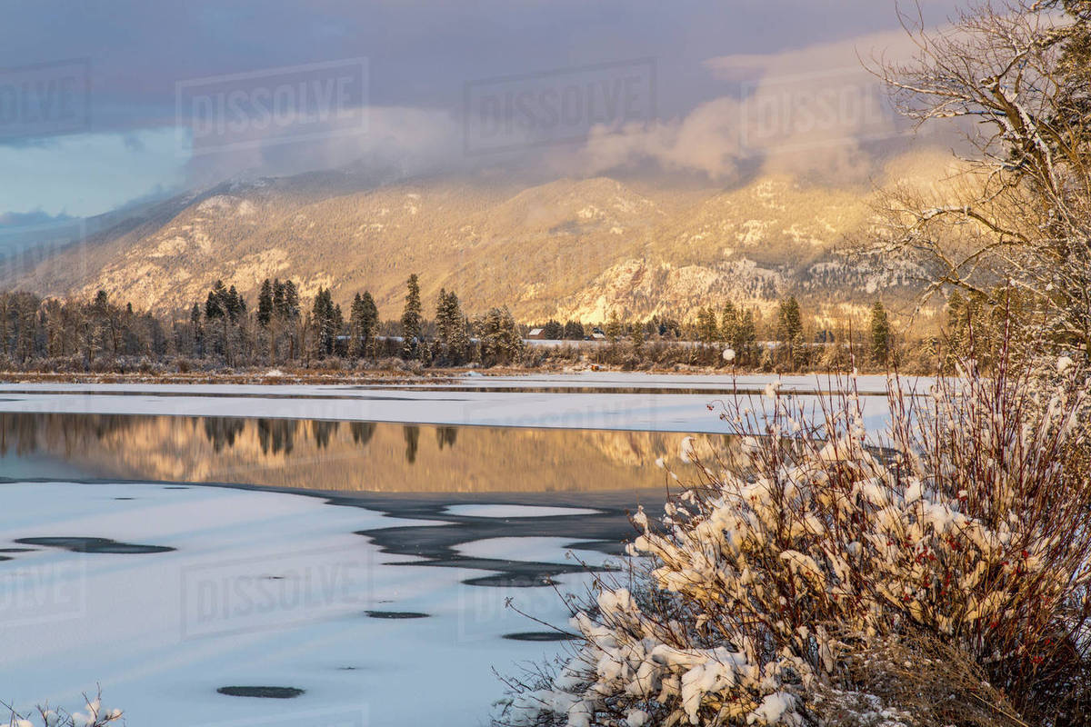 Late winter light on McWenneger Slough with Swan Mountains reflecting