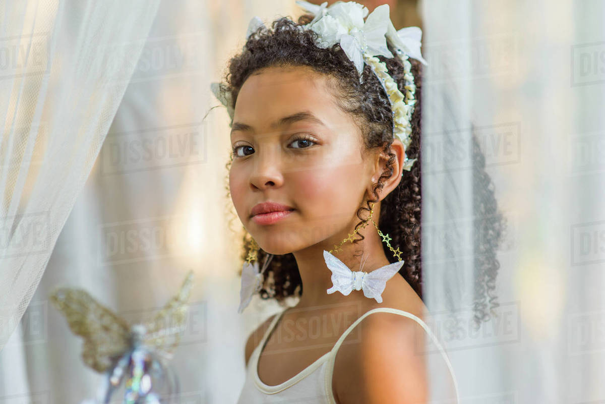 Portrait of young girl, dressed as fairy, wearing butterflies in hair Royalty-free stock photo