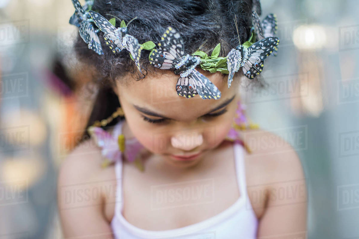 Portrait of young girl wearing butterflies in hair Royalty-free stock photo