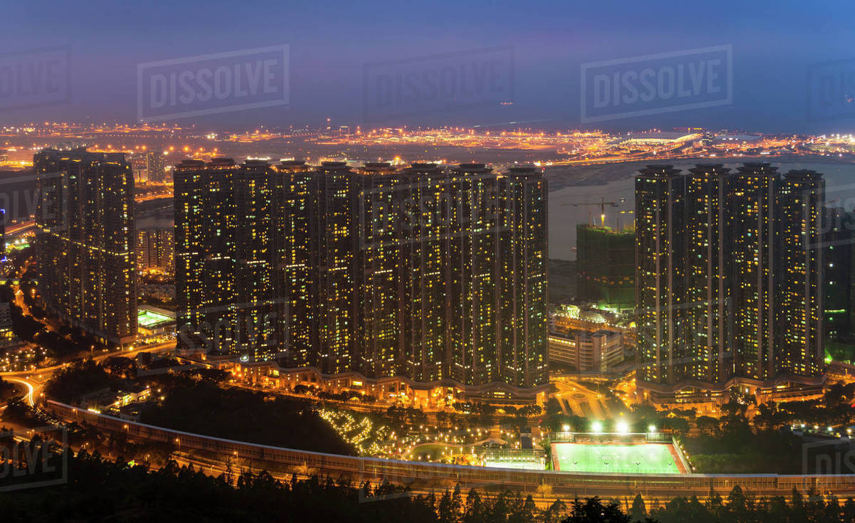 Tung Chung apartment buildings and Hong Kong airport, Hong Kong, China Stock Photo Dissolve