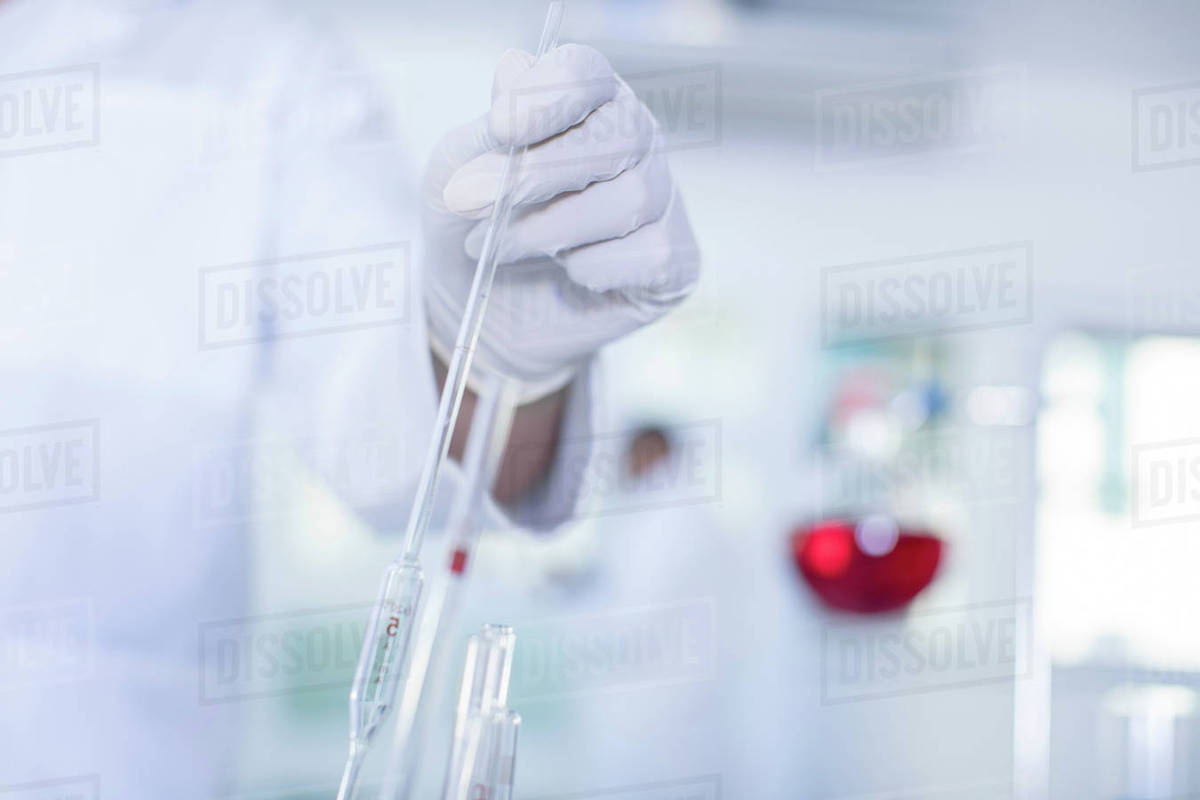 Laboratory worker doing experiment in lab, closeup Stock Photo