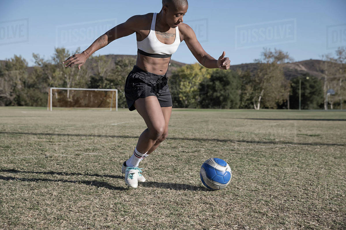 Women on football pitch playing football Stock Photo Dissolve