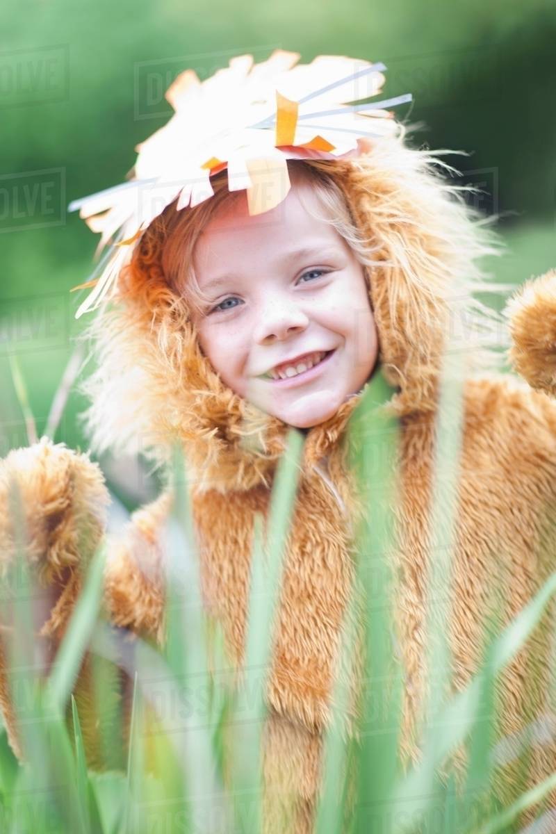 Child wearing lion costume Stock Photo Dissolve