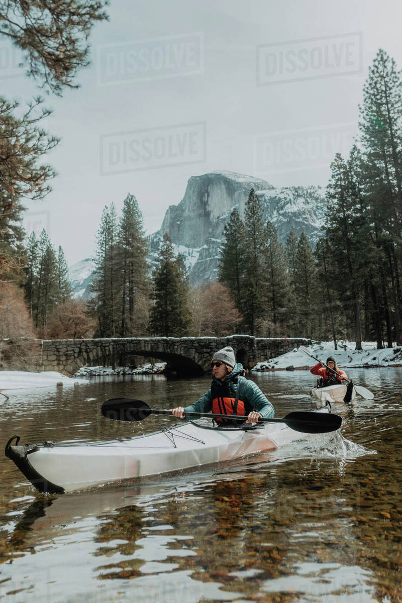 Friends kayaking in lake, Yosemite Village, California, United States