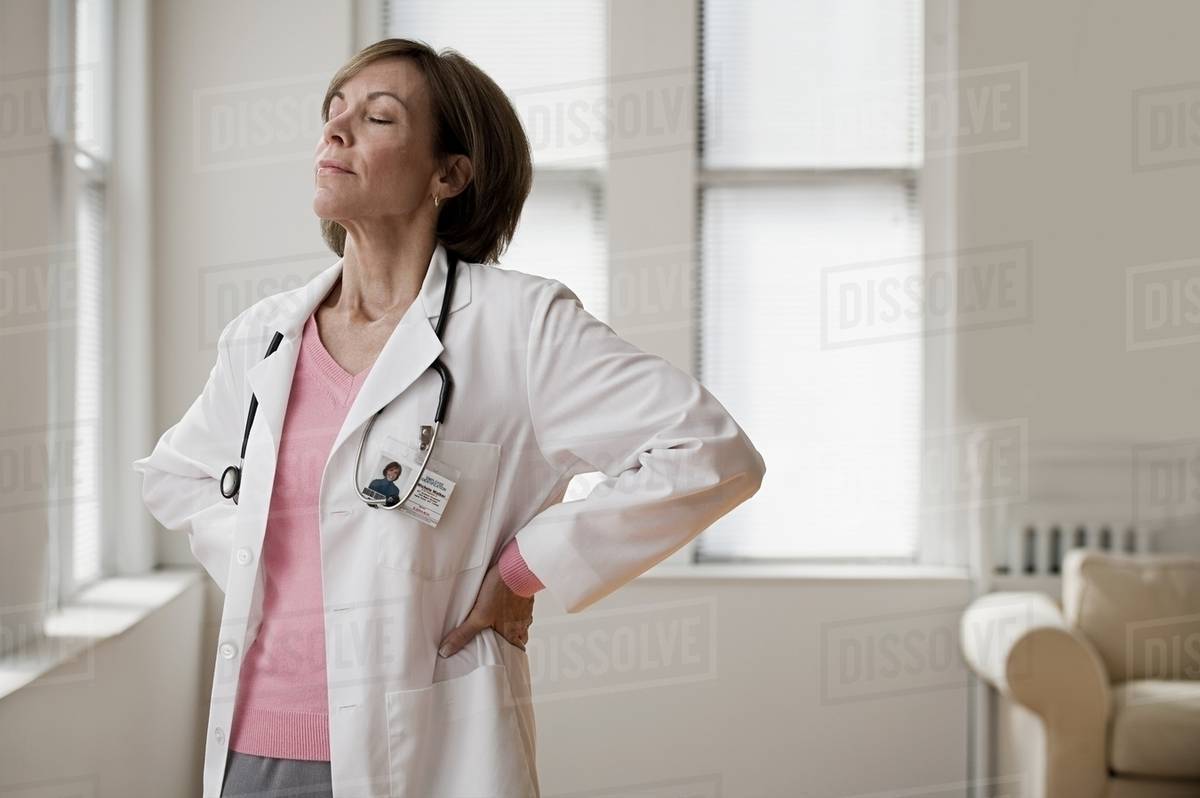 Doctor with eyes closed Stock Photo Dissolve