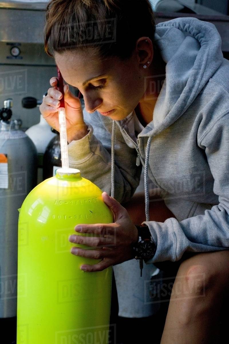 Visual inspection of scuba tank Stock Photo Dissolve