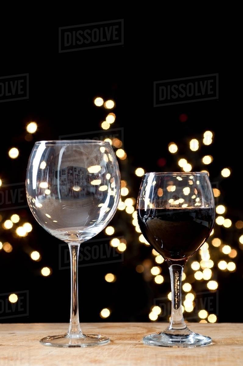 Large and small glasses of wine Stock Photo Dissolve